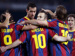 Sergio Busquets and Lionel Messi playing together for FC Barcelona