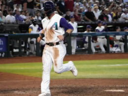 Christian Walker hitting a powerful home run in a baseball game