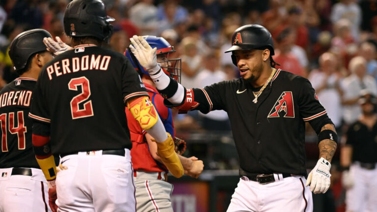 A player hitting a baseball on the field