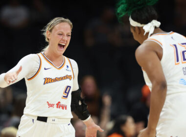 Phoenix Mercury basketball team celebrating victory on the court