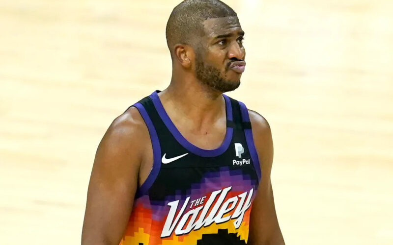 Chris Paul holding basketball, dreaming of an NBA title