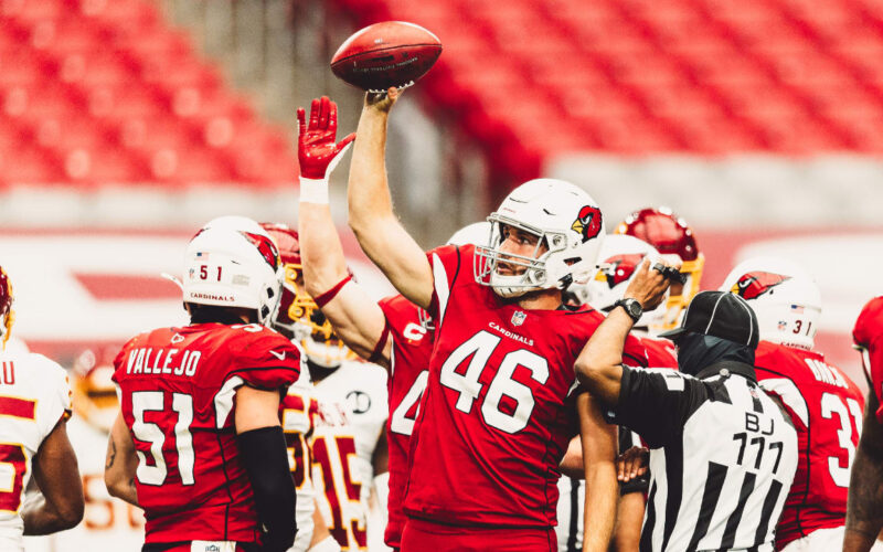 Aaron Brewer in Arizona Cardinals uniform, ready for the snap