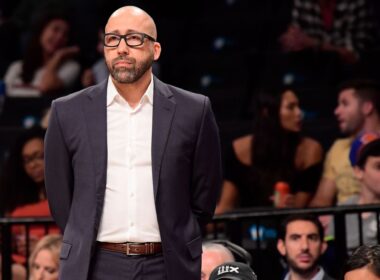 David Fizdale holding a clipboard during a basketball game