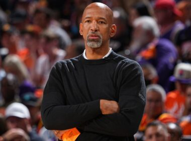 Monty Williams holding a basketball